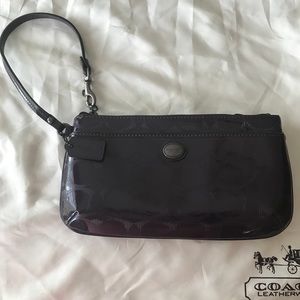 Patent large purple Coach wristlet, never used.